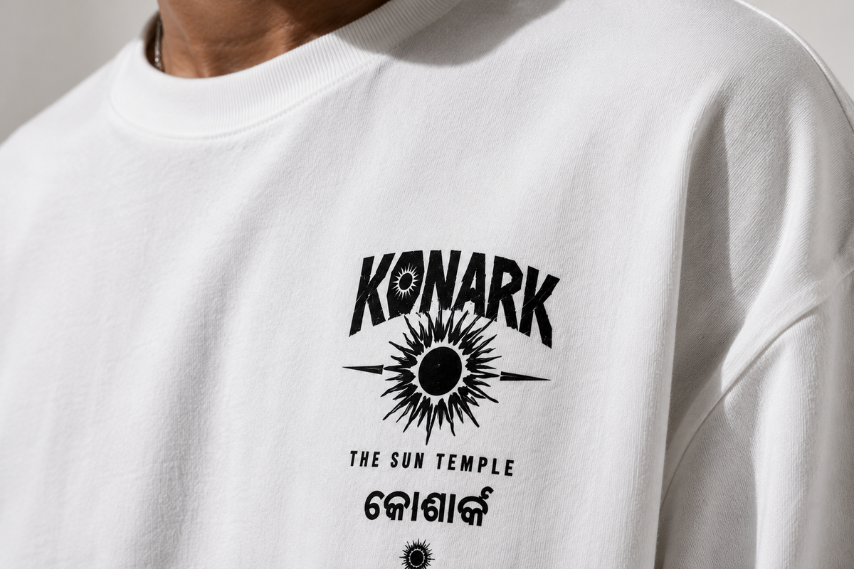 Konark oversized terry t-shirt in white, print close-up, worn by a model