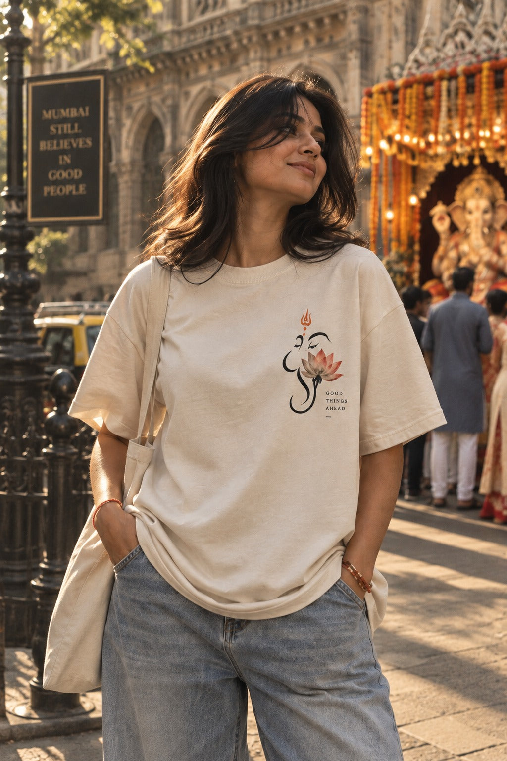 Lotus Bappa oversized t-shirt in off white, front chest print, worn by a model