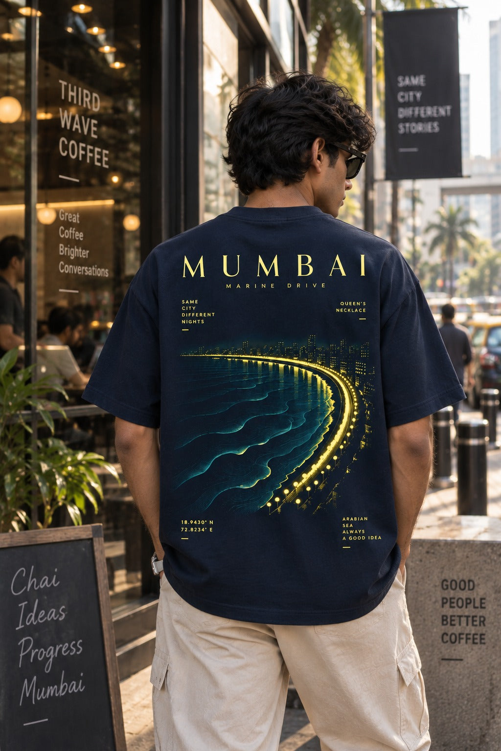 Mumbai Gold oversized t-shirt in royal blue, Marine Drive back print, worn by a model