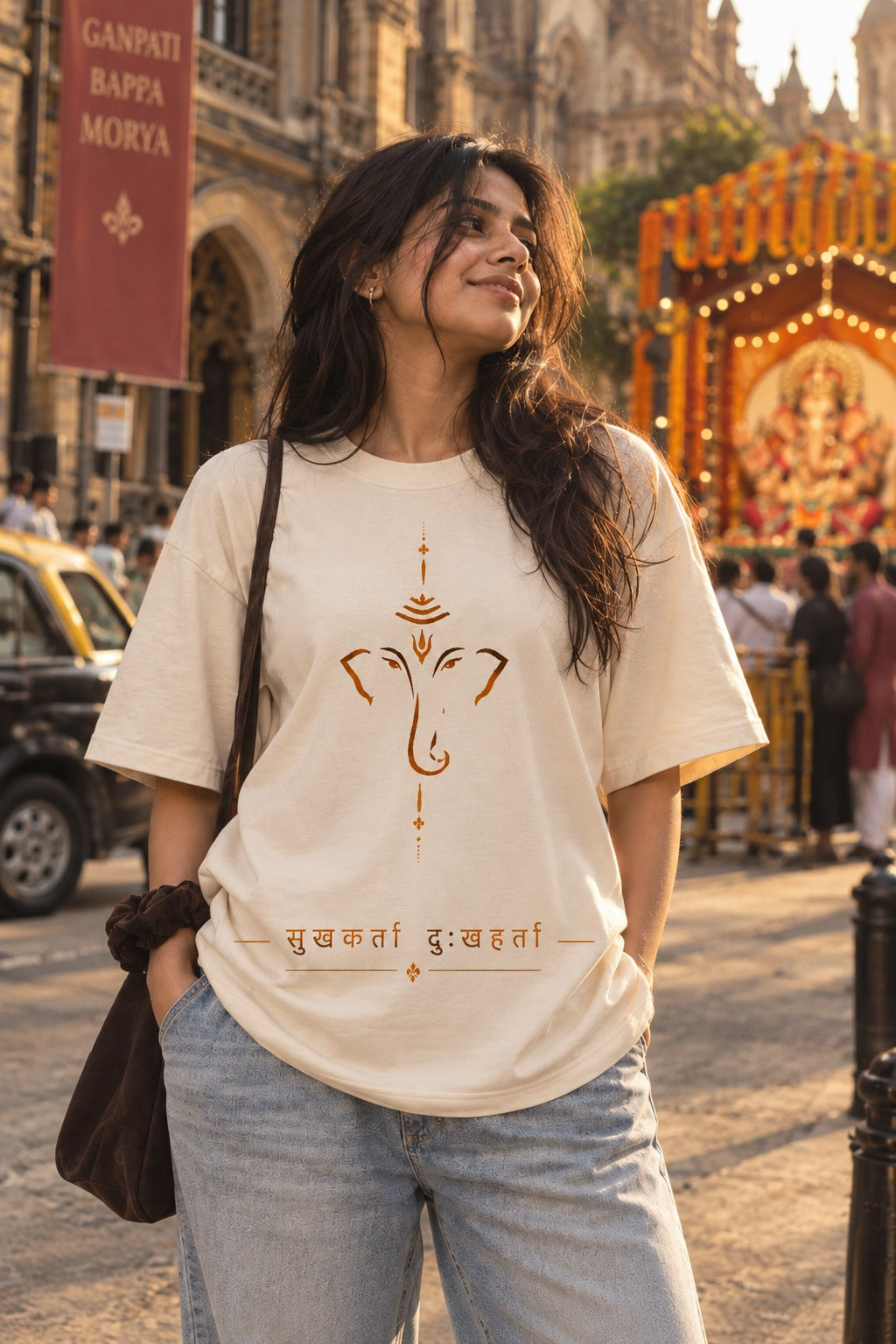 Sukhkarta oversized t-shirt in white, Ganpati front print, worn by a model